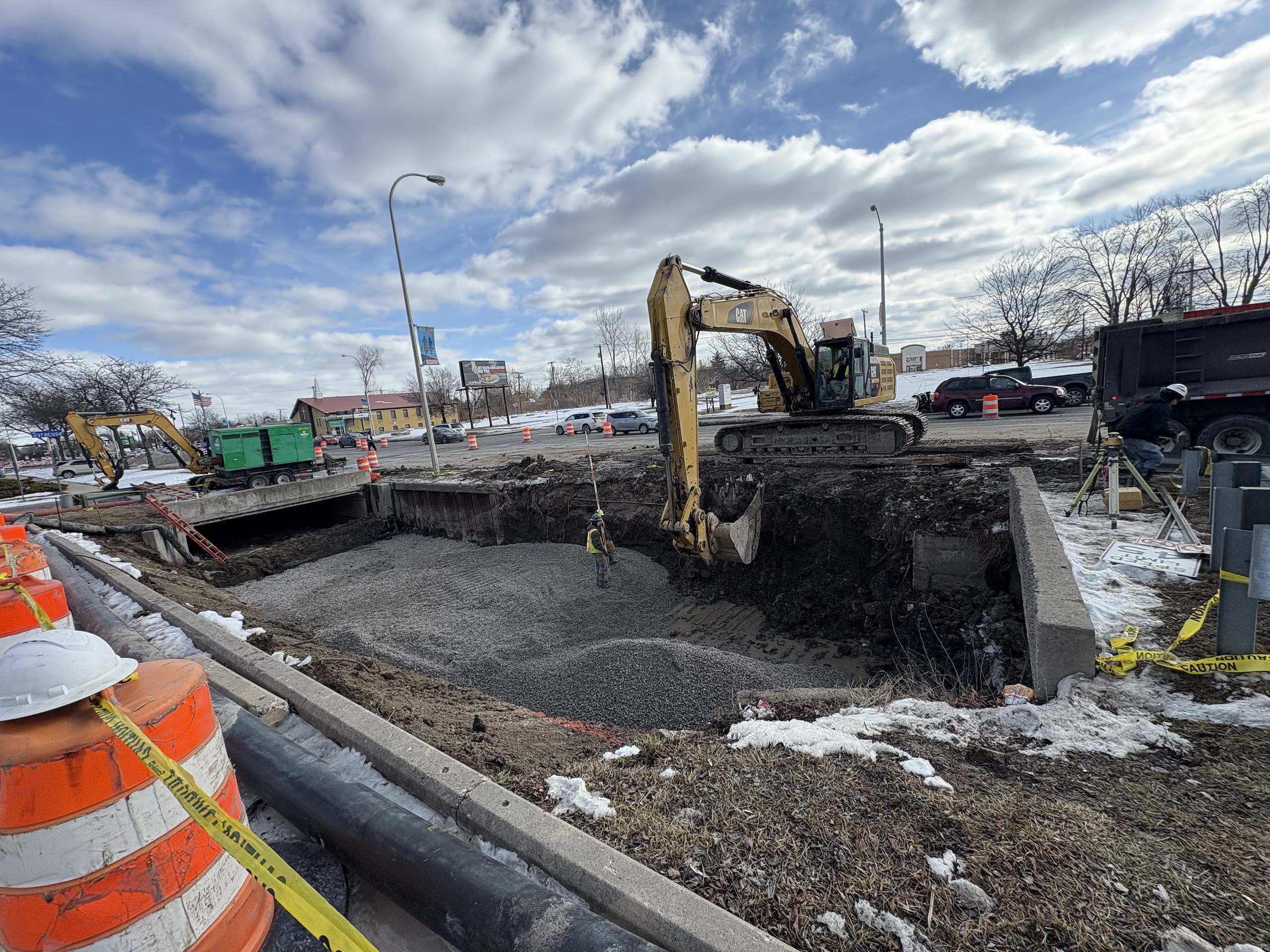 Excavating a drainage ditch