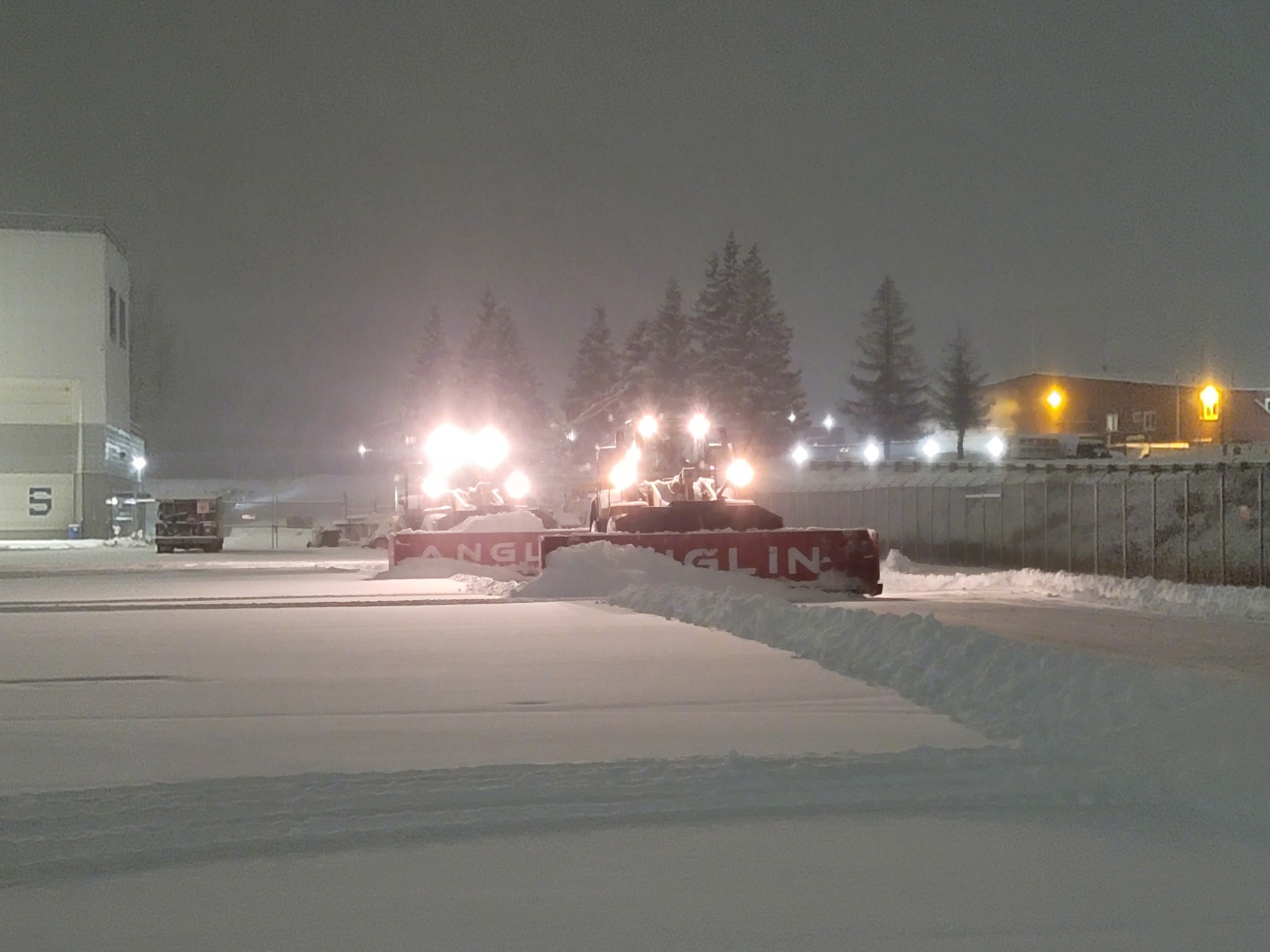 Anglin equipment plowing snow