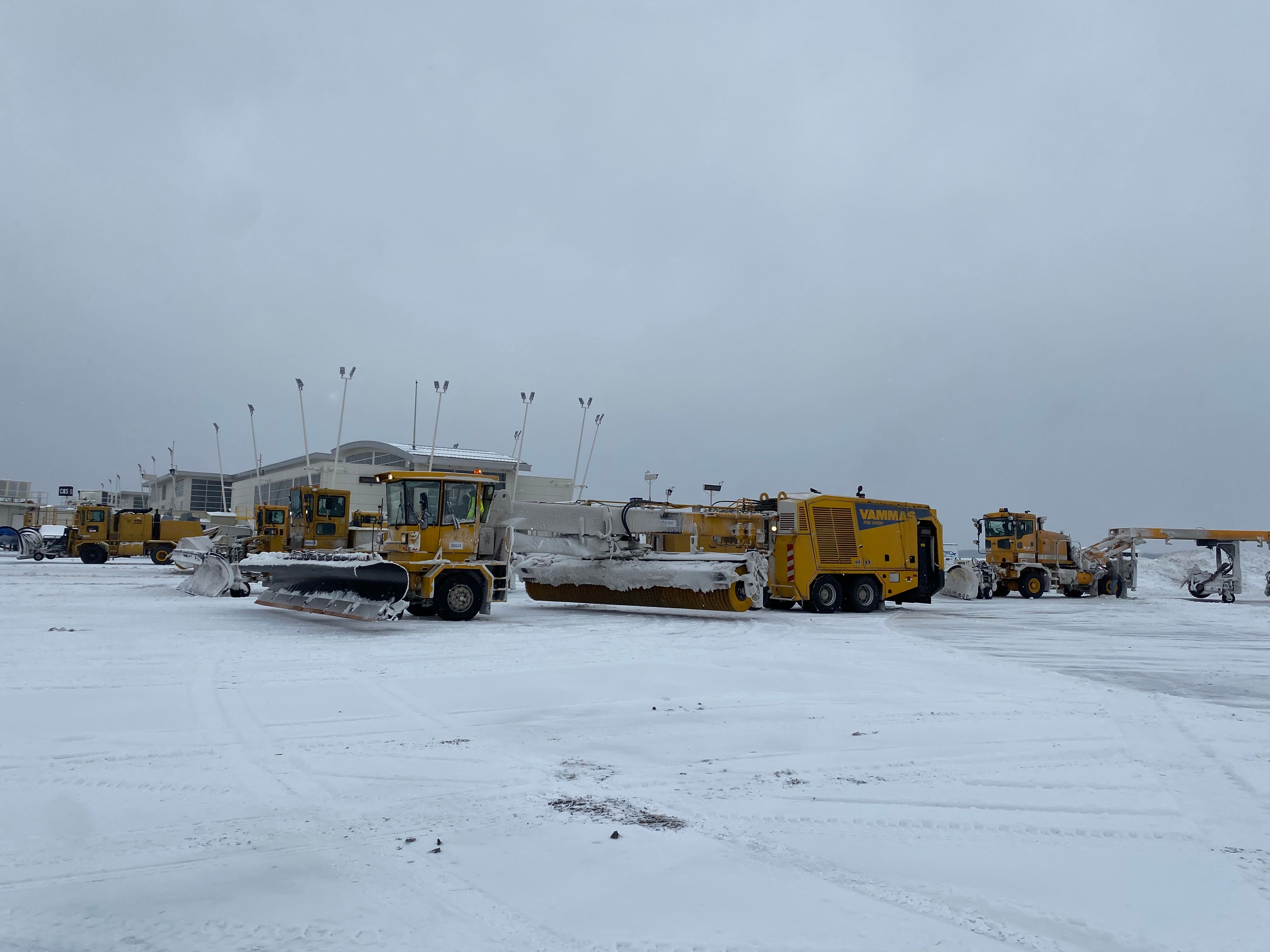 Anglin broom and angle blade clearing snow
