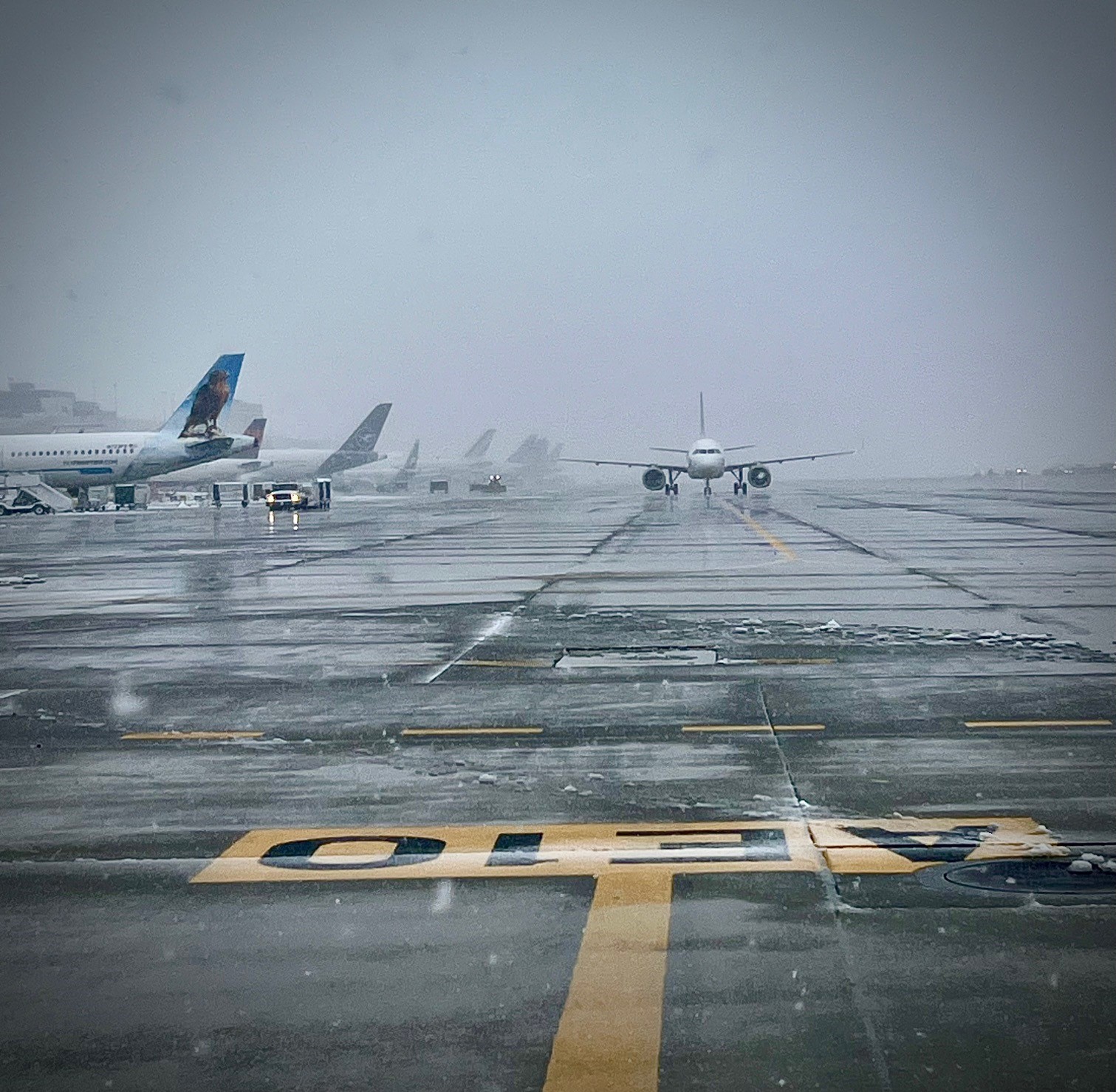 Plane taxiing with snow